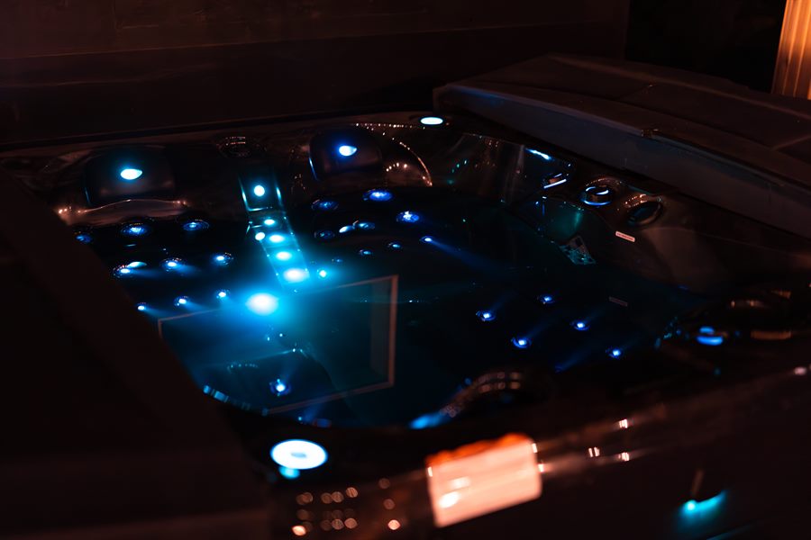 The chlorine-free mineral spa lit blue after dark