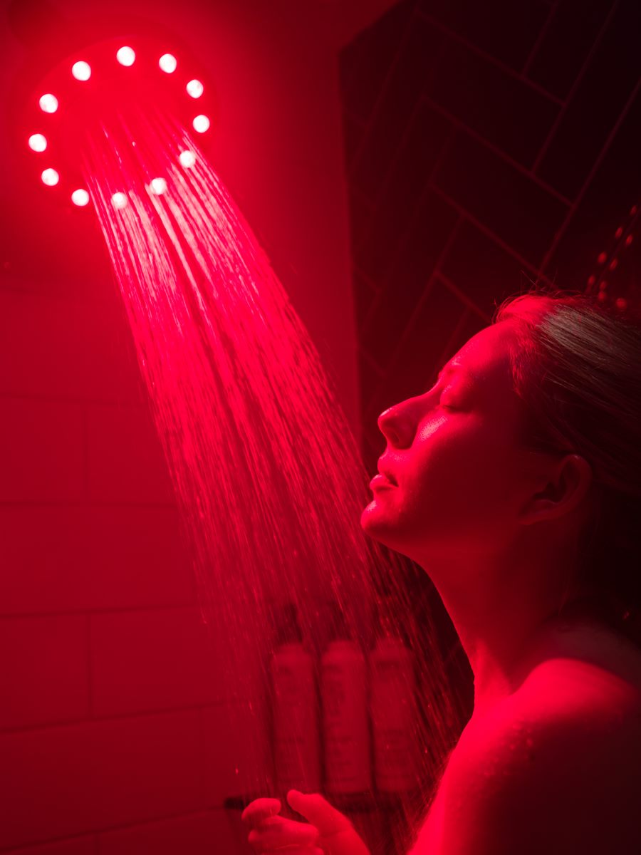 Guest under the HigherDOSE red-light shower