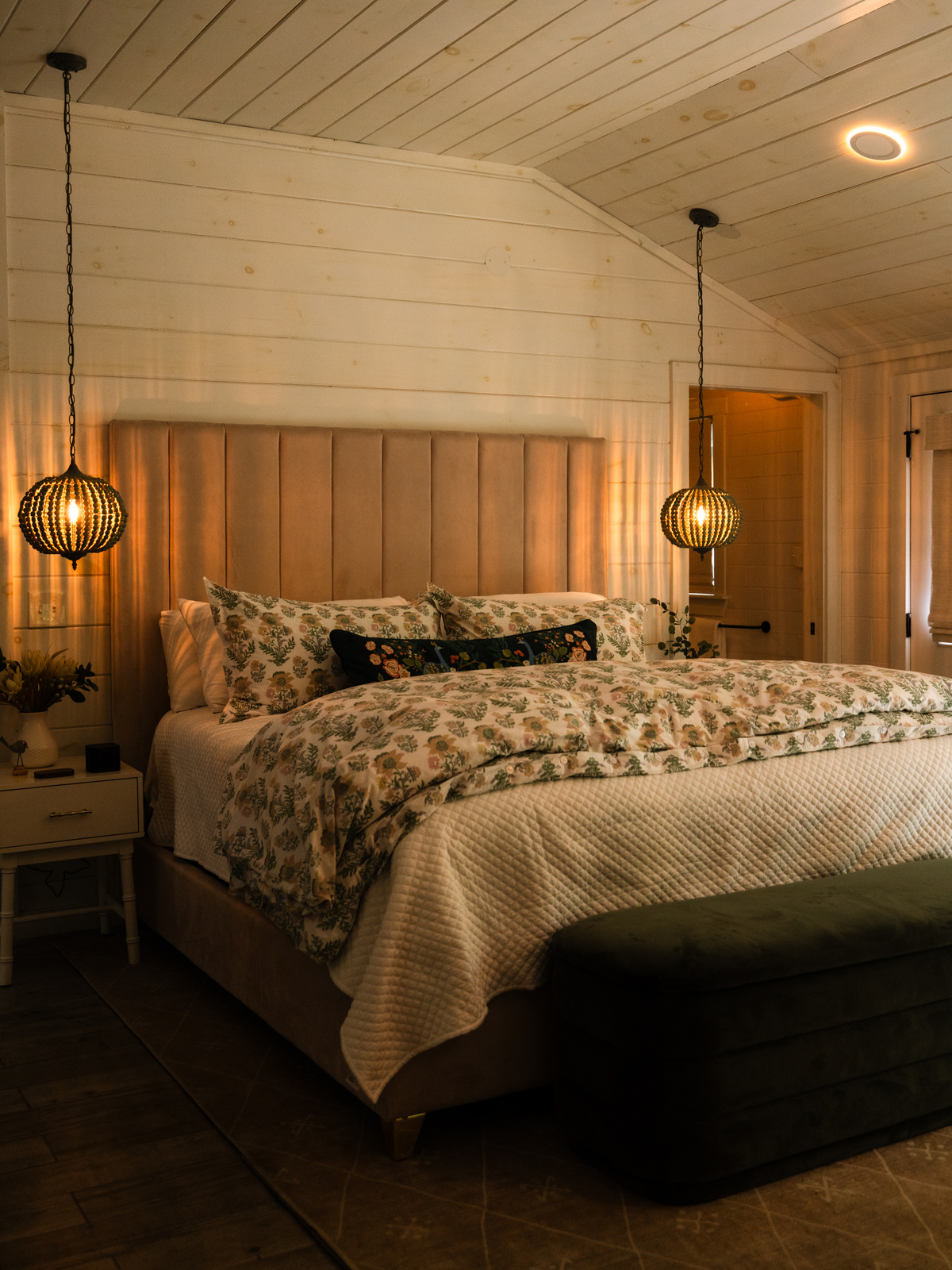 The king bed at Little Luxe set up as a sleep sanctuary